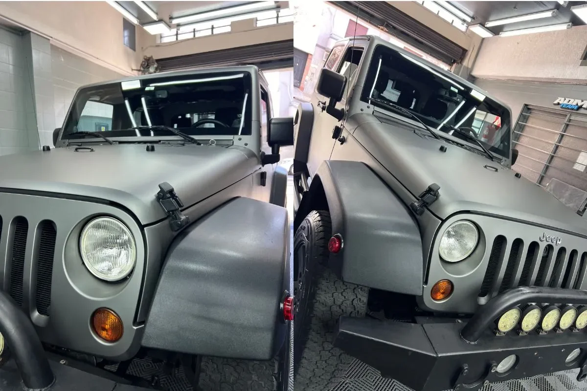 Jeep Wrangler ploteado en gris mate, visto de frente y de costado en el taller de ADM TEAM