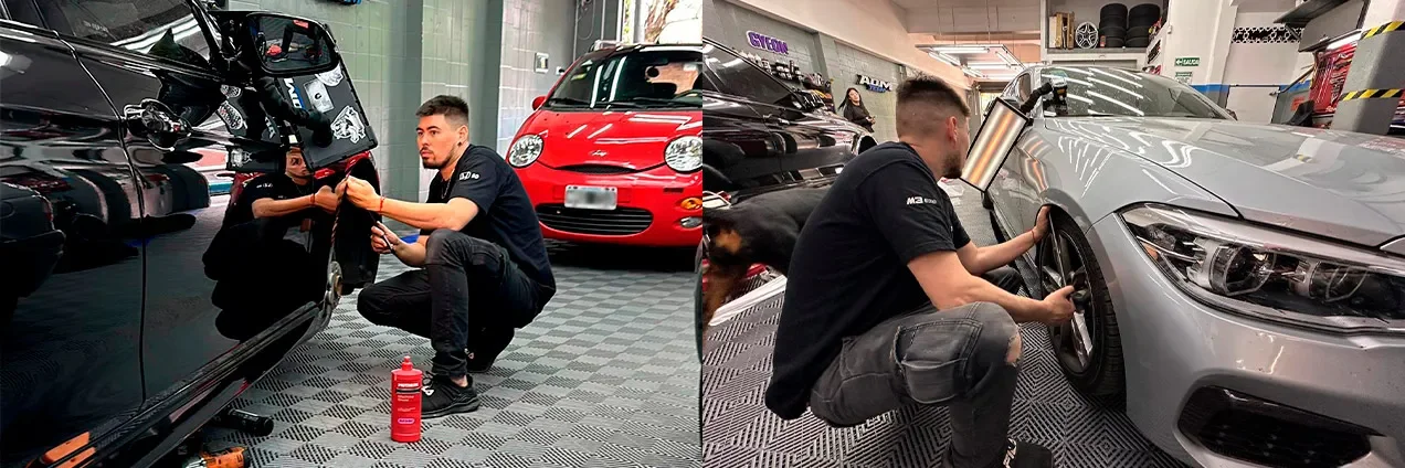 Técnicos de ADM TEAM trabajando abolladuras con herramientas de PDR en dos autos dentro del taller